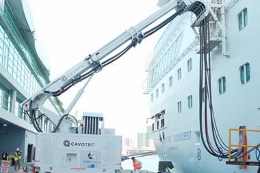 The image shows a Cavotec shore power system in action
