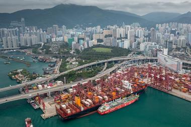 The image shows an overhead shot of the bunkering operation at the Port of Hong Kong