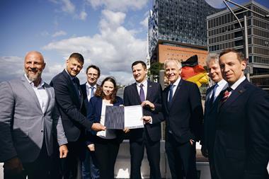 Representatives from Germany and Latvia at an MoU signing ceremony