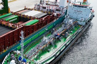 The image shows the first simultaneous methanol bunkering and cargo operation at Tuas Port