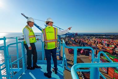 Two APM Terminals employees at the Port of Mobile
