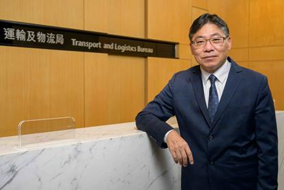 The picture shows Mr Lam Sai-hung standing facing the camera