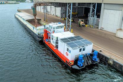 Picture shows the E-Pusher 1 in operations for emission free cacao transport in Amsterdam harbour