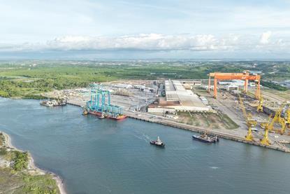 The image shows the new electric port equipment on the quayside