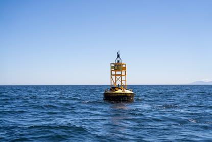 The image shows MarineLabs monitoring technology attached to a harbour buoy