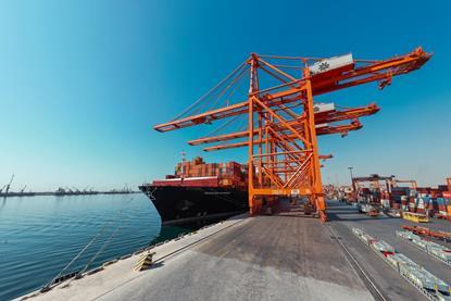 Ship-to-shore cranes and a cargo ship at the Port of Salalah