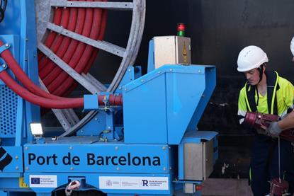 Two engineers looking at a shorepower connection at the BEST terminal in Barcelona