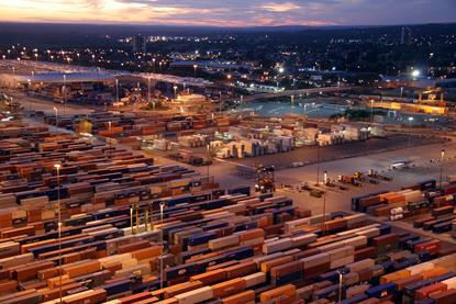 The image shows a night aerial view of container yard at Southampton terminal
