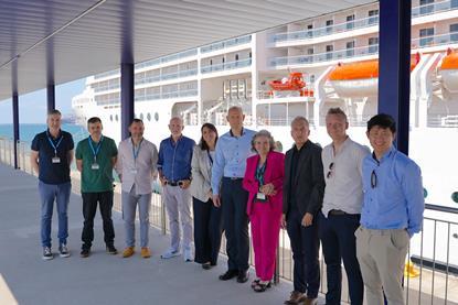 The image shows Ana Arévalo, head of the shorepower department at the Port of Barcelona, with several members of her team, the manager of the MSC terminal, Sandra Yunta, and Peter Castberg with the PowerCon team in charge of developing the project