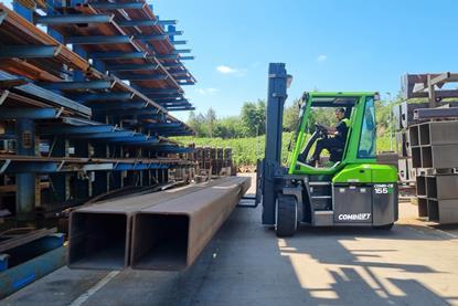 The image shows the Combi-CB70E at work in a yard