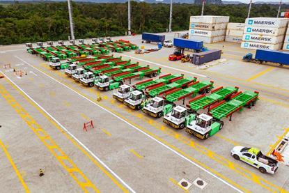 The image shows an overhead shot of the Sany electric terminal tractors in the terminal yard