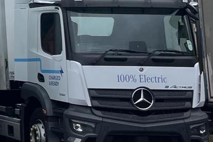 The image shows a close-up of an electric HGV which will be tested by DP World UK