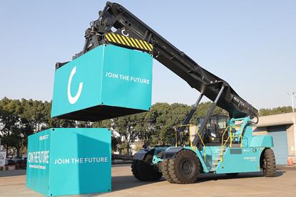 Konecranes new electric reach stacker in operation lifting boxes on the quay side