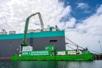 Green STAX vessel capturing carbon at a port