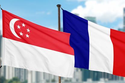 Picture shows the French and Singaporean flag flying at the port