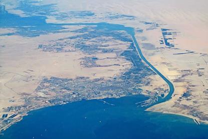 Aerial_view_of_city_of_Suez_and_Suez_Canal