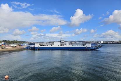 The image shows the Torpoint ferry on the water
