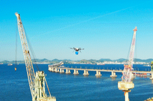 a drone being used to deliver equipment to ships