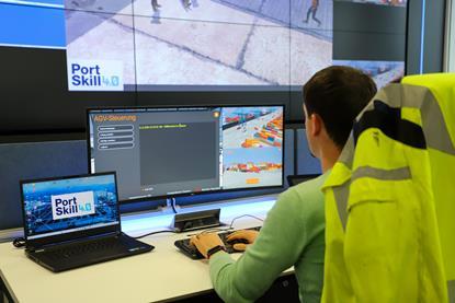 The image shows an HHLA employee testing the training control centre developed as part of PortSkill 4.0 at the CTA