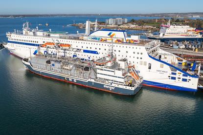 The image shows The Brittany Ferries’ electric-hybrid vessel, Saint-Malo, receiving LNG bunkering from Optimus