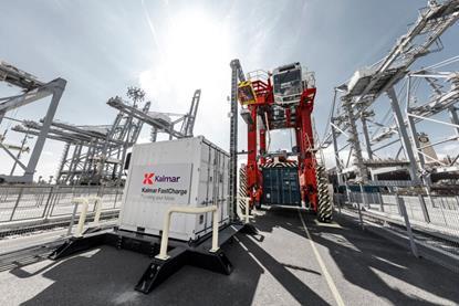 The image shows a Kalmar electric straddle and charging infrastructure