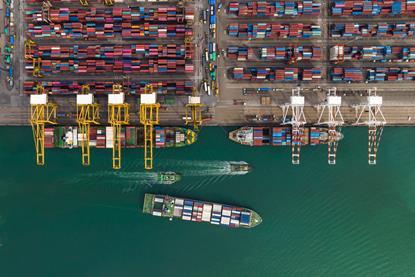Cargo ship and truck at seaport waiting for container dock by crane shipment