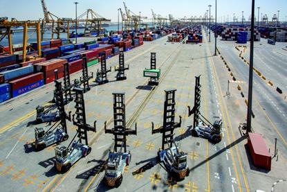 The image shows multiple Konecranes lift trucks on the quayside