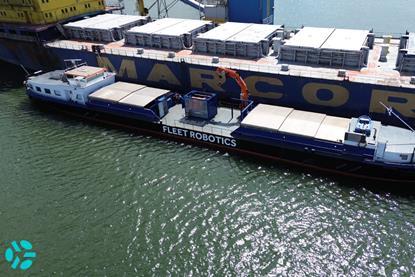 Fleet Robotics ship next to a container ship
