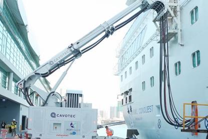 The image shows a Cavotec shore power system in action