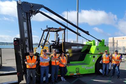 The image shows the San Diego battery electric forklift with the crew posing in front