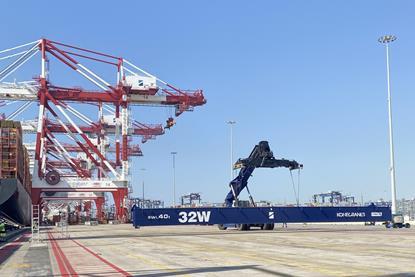 The image shows electric terminal equipment on the quayside at Hutchison Ports BEST at Barcelona Port