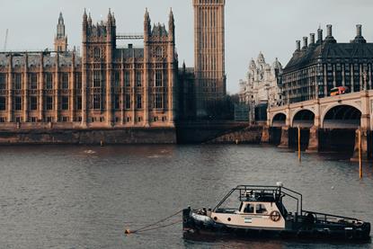 The image shows the River Thames with Big Ben and the Houses of Parliament in the background