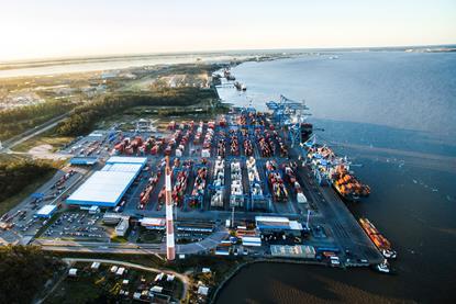 The photo shows an aerial vista of Wilson Sons' Tecon Rio Grande terminal
