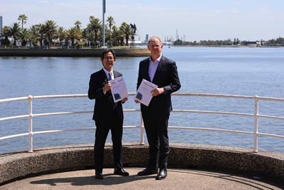 The image shows Takehiko Kikuchi, Senior Fellow and Chief Regional Officer for Asia Pacific & India at MHI (left) and Craig Carmody, CEO, Port of Newcastle (right)