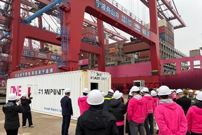 The image shows ONE’s AMP container beng lifted into place at NZPG’s terminal