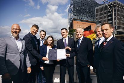 Representatives from Germany and Latvia at an MoU signing ceremony