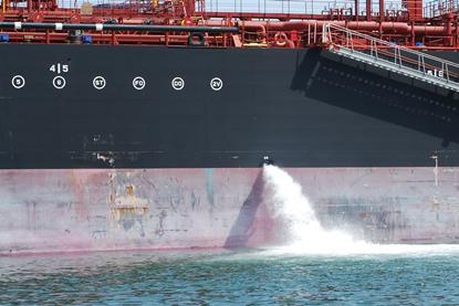 Ballast water being discharged from a ship