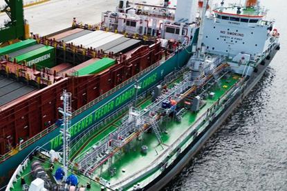 The image shows the first simultaneous methanol bunkering and cargo operation at Tuas Port