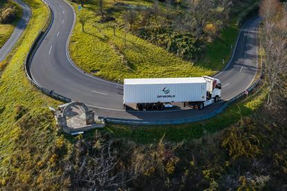 A picture of a DP World branded freight truck on the road