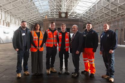 Maritime Minister Mike Kane (third from right) with Forth Ports apprentices and graduates in the historic Tilbury railway station at the Port of Tilbury