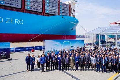 The image shows Astrid Mærsk berthed at Yangshan port in Shanghai for the first green methanol bunkering with simultaneous cargo and bunkering operations in China