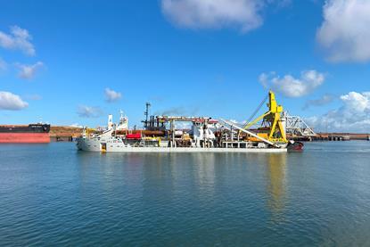 The image shows the vessel J.F.J. De Nul performing dredging and reclamation works in Port Hedland