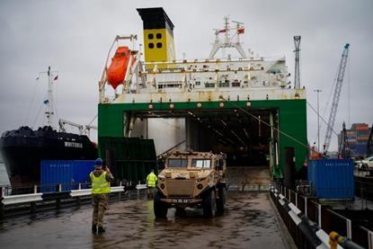 An army jeep driving off a ferry at an ABP port in the UK