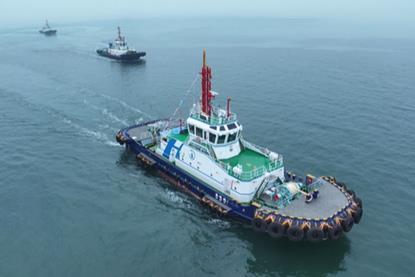 The image shows the Qing Dian Tuo 1 on the water
