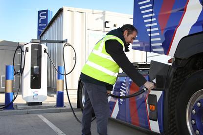 An image of a person charging an electrical HGV at the Tilbury eHGV charing hub