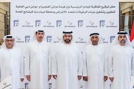 Members of DP World celebrating the agreement to develop Fujairah