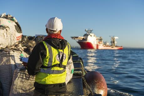 Ship supply launch approaching Multi-Purpose offshore vessel