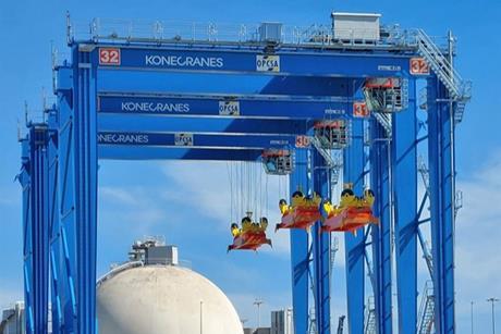 The image shows the Konecranes hybrid RTGs already in operation at OPCSA