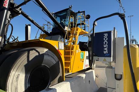 The image shows the Taylor Machine Works container handler on charge at Long Beach
