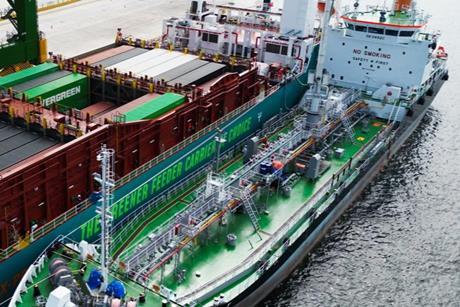 The image shows the first simultaneous methanol bunkering and cargo operation at Tuas Port